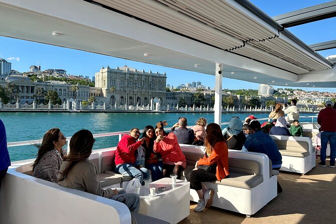 Bosphorus Daytime or Sunset Sightseeing Cruise & Audio Guide - Dolmabahçe Mosque and Palace: first big Ottoman landmarks from the water