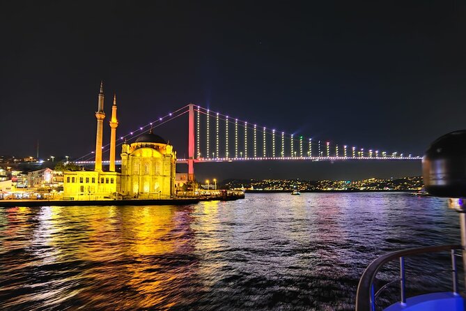 Bosphorus Night Lights: Guided Cruise With Tea and Cookies - Two illuminated suspension bridges: the Europe-Asia crossover