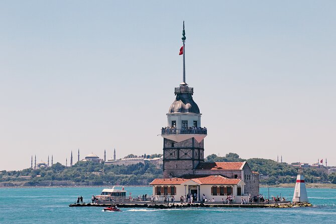 Luxurious Bosphorus Small Group Sunset Yacht Cruise with Snacks - Dolmabahçe Mosque and Palace from the water, where gold and crystal show up fast